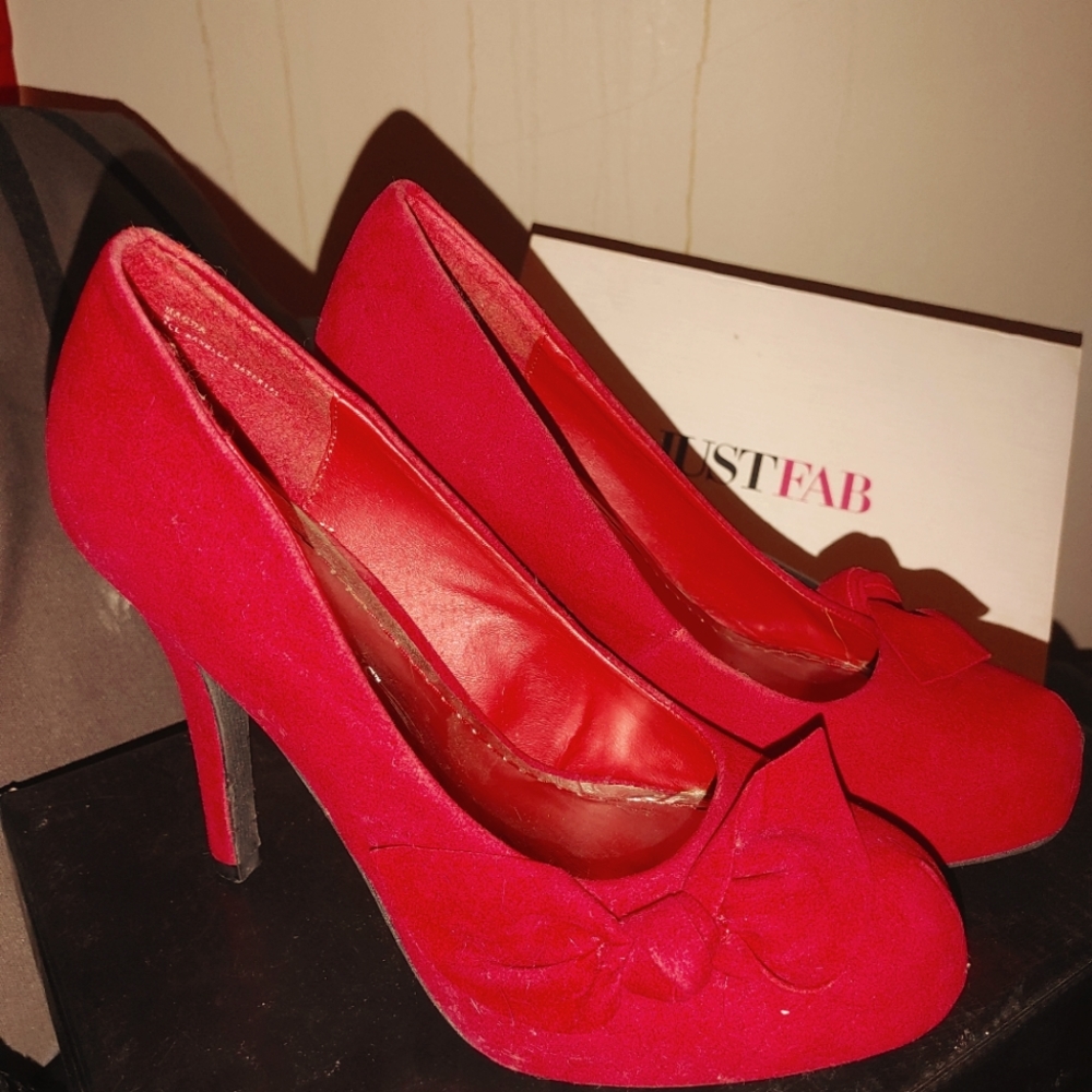 Red suede rosette heels